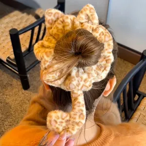Cute plush leopard print cat hair scrunchie with ears and tail, soft winter hair accessory.