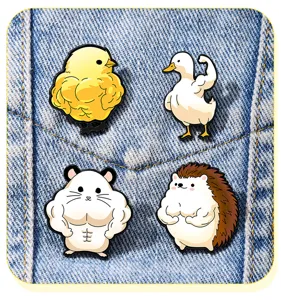 Detail view of creative funny muscle animal enamel pins displayed on denim fabric.