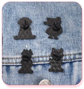 Close-up detail of the metal cartoon animal doctor brooches back showing secure rubber pin clutches.