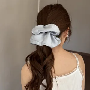 Large satin hair scrunchie for women, elegant light blue ponytail holder hair tie for daily wear.