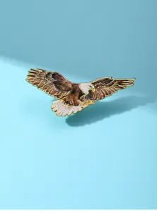 Close-up detail of the flying eagle metal lapel pin, elegant bird brooch accessory.