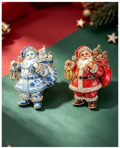 Close-up detail of vintage Santa Claus enamel rhinestone brooch with gift bag and lantern.