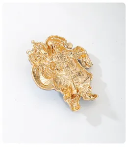 Gold tone Christmas brooch pin back view showing secure clasp and metal craft details.
