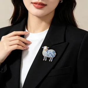 Elegant blue and white porcelain style sheep brooch with enamel and sparkling rhinestones.