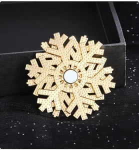 Exquisito copo de nieve de oro imán de nevera giratorio y accesorio de ropa elegante.