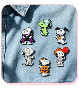 Close-up detail of cute Halloween Snoopy enamel pins set, featuring various spooky festive designs.