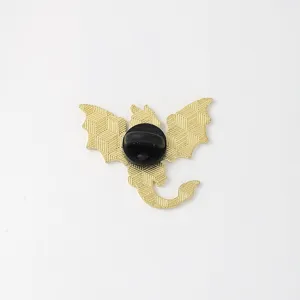 Western dragon metal brooch pin back view, gold tone detailed texture fashion accessory.