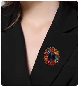 Detail shot of a vintage alloy rhinestone floral brooch featuring colorful crystal rhinestones.