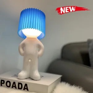 Cute shy boy USB rechargeable night light with two-level dimming for bedroom desk decor.