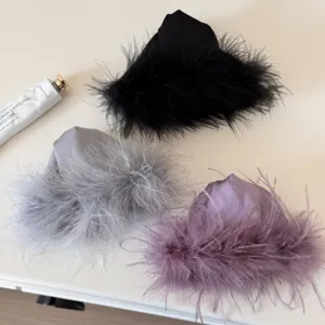 Exquisite feather hair claw clip detail showcasing soft fluffy plush texture and elegant design.