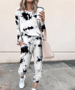Detail view of casual tie-dye long sleeve sweatshirt and sweatpants lounge set for women.