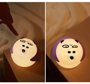 Silicone touch night light featuring a cute cartoon face, providing soft warm bedside lighting.