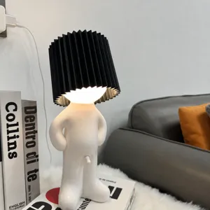 Quirky shy boy night light with black pleated shade, USB rechargeable, cute bedroom desk decor.