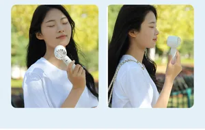 Portable handheld fan USB rechargeable mini cooling fan for outdoor travel and daily use.