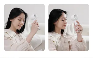 Portable handheld mini fan usage detail view, compact USB rechargeable design for cooling.