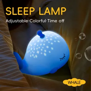 Veilleuse mignonne en silicone baleine avec projection d'étoiles, couleurs et minuterie réglables.