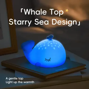 Detail de veilleuse en silicone baleine mignonne, effet de projection etoilee, douce lueur.