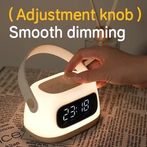 Detail shot of portable night light alarm clock featuring stepless dimming knob and LED screen.