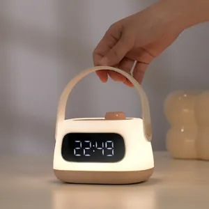 Detail view of the portable alarm clock night light with digital LED display and warm glow base.