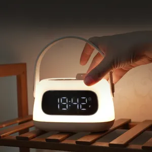 Portable bedside alarm clock night light with LED display, USB rechargeable and dimmable.