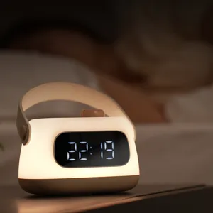 Portable digital alarm clock night light with USB charging and warm LED display for bedside.