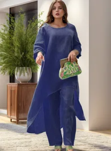 Detail van de casual linnen set met een asymmetrische top en comfortabele wijde broek.