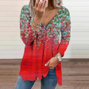 Close-up view of women's floral V-neck long sleeve top with front zipper detail, casual wear.