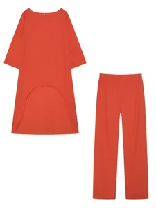 Gedetailleerd overzicht van de oranje katoenen linnen top met lange mouwen en broek.