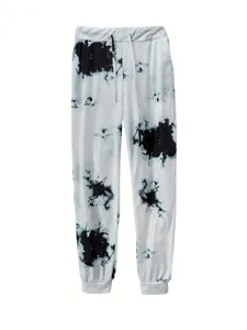 Detailansicht der schwarz-weißen Batik-Jogginghose mit elastischem Kordelzug und Bündchen.