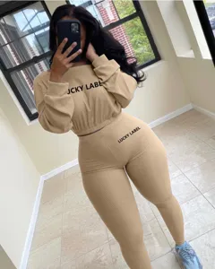 Detail shot of a women's ribbed knit two-piece casual activewear set in khaki color.