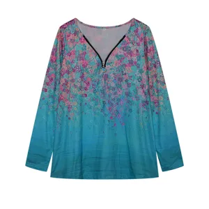 Detailed view of the V-neck long sleeve top featuring a chic ring zipper and vibrant floral print.