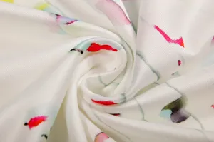 Close up view of women floral print fabric detail showing soft texture and colorful pattern.