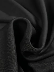 Black jacket fabric detail shot, premium solid texture for women sportswear two-piece set.
