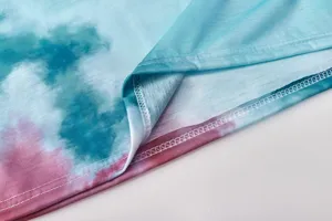 Tie-dye long sleeve top fabric detail, soft knitted texture, delicate stitching craftsmanship.