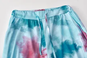 Close-up detail of women casual tie-dye pants waistband and drawstring in blue pink.