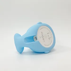 Détail veilleuse baleine en silicone avec port de charge, interrupteurs et spécifications.