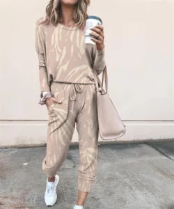 Detailed view of women casual tie-dye long sleeve sweatshirt and joggers loungewear set.
