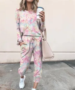 Detail view of the colorful tie-dye long sleeve sweatshirt and matching lounge pants set.
