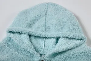 Light blue plush fleece hoodie detail shot, warm and soft winter casual pullover top for women.