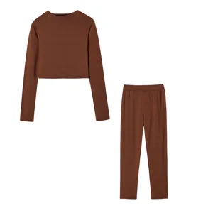 Brown long sleeve crop top and pants set detail shot, showing fine fabric and stitching.