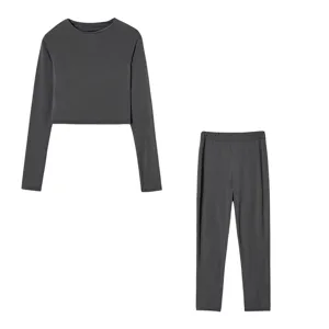 Dark grey women slim fit long sleeve crop top and pants set detail view, casual sports outfit.