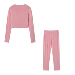 Pink long sleeve top and matching slim trousers set, ideal for casual wear and daily comfort.