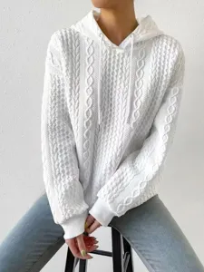 White cable-knit hoodie detail shot, featuring textured fabric and drawstring close-up.
