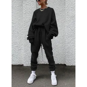 Solid black casual sweatshirt and sweatpants tracksuit set for women, comfortable autumn wear.
