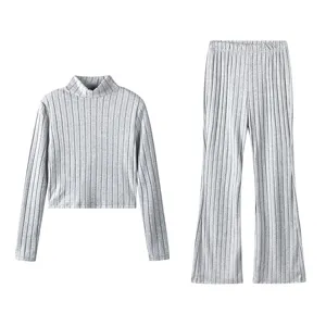 Close-up detail of the grey ribbed knit two-piece set, featuring texture and fabric.