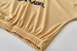 Close-up detail of women's autumn ribbed letter embroidered casual top, soft and stylish.