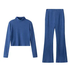 Blue ribbed knit two-piece set featuring a cozy turtleneck top and elegant flare pants.