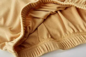 Ribbed fabric detail of women's casual sportswear, showing elastic waistband texture.