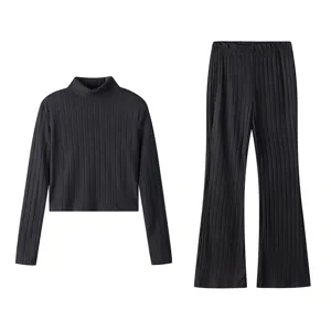 Black ribbed knit long sleeve turtleneck top and flared trousers two piece set for women.