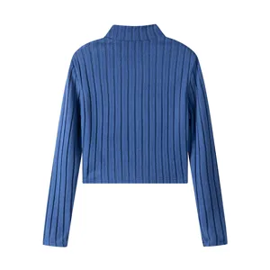 Blue ribbed knit long sleeve top detail view showcasing texture and fabric quality.